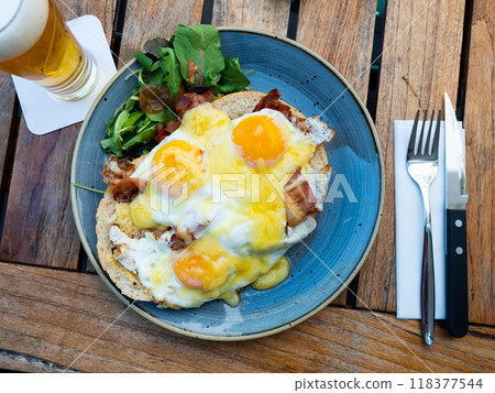 Dutch sandwich uitsmijter on white bread with fried bacon, eggs and cheese Dutch sandwich uitsmijter on white bread with fried bacon, eggs and cheese 118377544