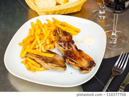 Churrasco de ternera, grilled veal spare ribs with fries 118377708