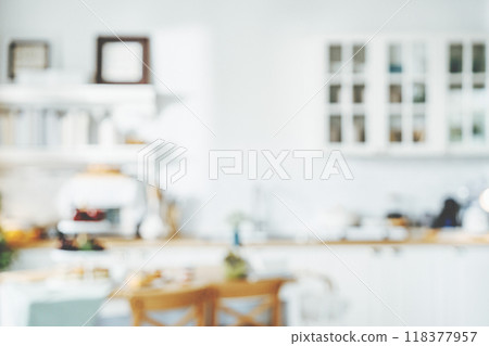 Blurred background modern kitchen and dinning room in house with bokeh light 118377957