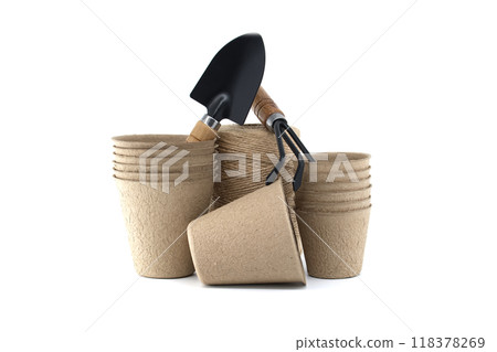 Eco-friendly gardening tools including organic pots, metal trowels isolated on white Eco-friendly gardening tools including organic pots, metal trowels isolated on white 118378269
