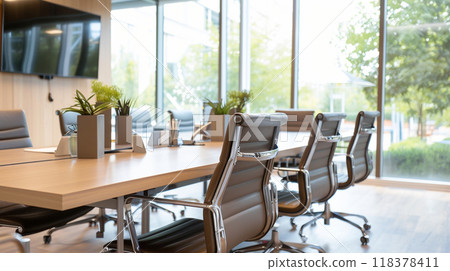 A large conference room with a long table and several chairs A large conference room with a long table and several chairs 118378411