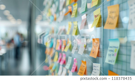 A wall covered in colorful sticky notes with various words A wall covered in colorful sticky notes with various words 118378435