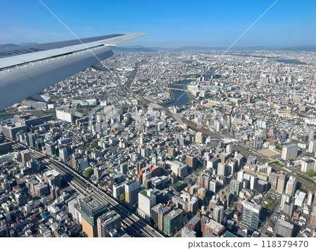 A residential area on the outskirts of Osaka City, seen from inside the aircraft descending towards Itami Airport 118379470