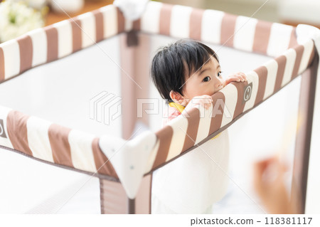 10-month-old boy standing up 118381117