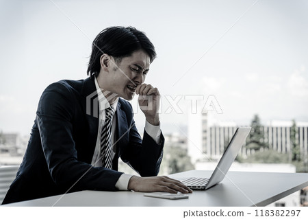 A young Asian businessman suffering from runny and stuffy nose due to hay fever, allergies, and colds (allergic rhinitis and anosmia) A young Asian businessman suffering from runny and stuffy nose due to hay fever, allergies, and colds (allergic rhinitis and anosmia) 118382297