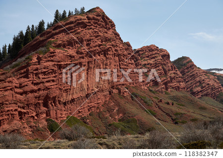 Red rocks sandstone cliff, gorge Jety-Oguz. Popular touristic location, travel 118382347
