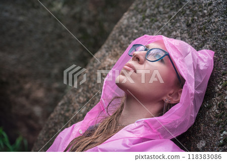 Woman in the taiga forest and rocks of the Stolby nature reserve park Woman in the taiga forest and rocks of the Stolby nature reserve park 118383086