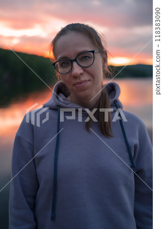 Woman sitting on the pier Woman sitting on the pier 118383090