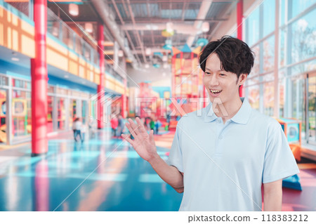 A young man working in a kids' space 118383212