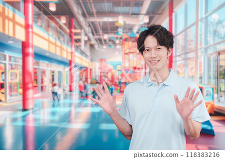 A young man working in a kids' space 118383216