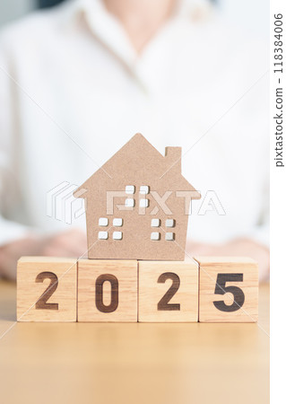 Happy New Year 2025 with house model. real estate, Home loan and mortgage, tax, investment, financial, savings and New Year Resolution concepts Happy New Year 2025 with house model. real estate, Home loan and mortgage, tax, investment, financial, savings and New Year Resolution concepts 118384006