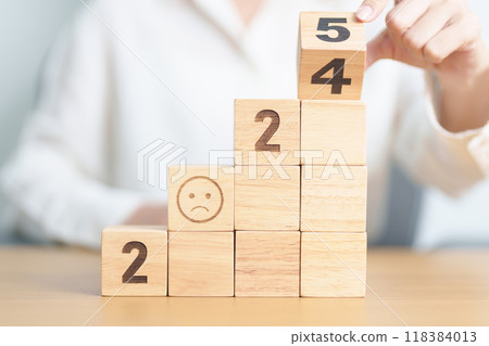 Happy New Year 2025 with Sad face block. Satisfaction, feedback, Review, mental health, eco sustainable and bad year concept 118384013