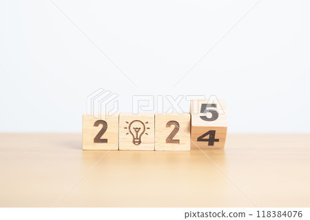 2024 year change to 2025 year block with lightbulb. Business Idea, Creative, Thinking, brainstorm, Goal, Resolution, strategy, plan, Action, change and New Year start concepts 2024 year change to 2025 year block with lightbulb. Business Idea, Creative, Thinking, brainstorm, Goal, Resolution, strategy, plan, Action, change and New Year start concepts 118384076