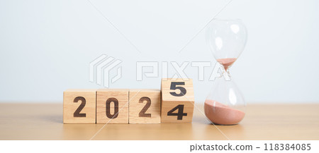 2024 end year to Happy New Year 2025 with hourglass on table. Resolution, time, plan, goal, motivation, reboot, countdown and New Year holiday concepts 118384085