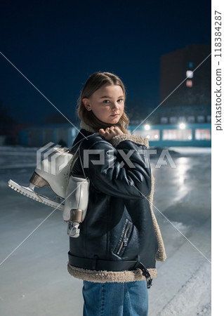 Beautiful young woman is ready for ice skating Beautiful young woman is ready for ice skating 118384287