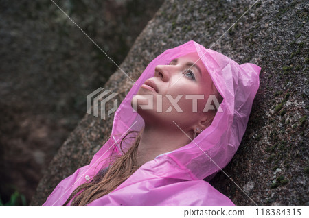 Woman in the taiga forest and rocks of the Stolby nature reserve park Woman in the taiga forest and rocks of the Stolby nature reserve park 118384315