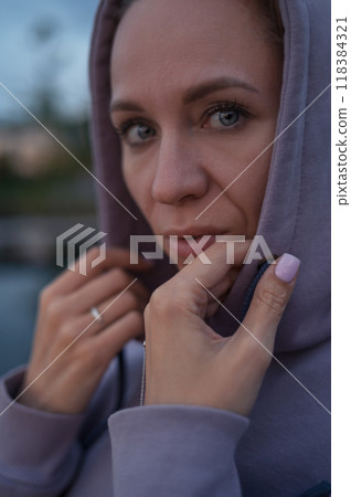 Woman sitting on the pier Woman sitting on the pier 118384321