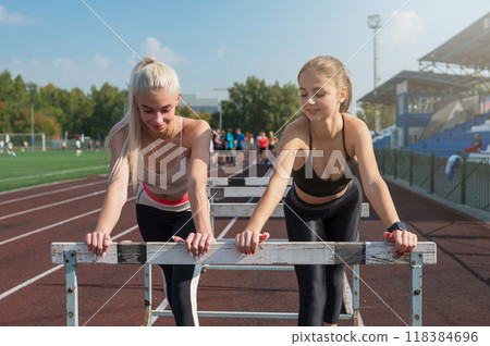 Two athlete young woman runner at the stadium Two athlete young woman runner at the stadium 118384696