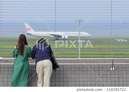 Observation deck at Haneda Airport Passengers watching planes take off from the observation deck Observation deck at Haneda Airport Passengers watching planes take off from the observation deck 118385722