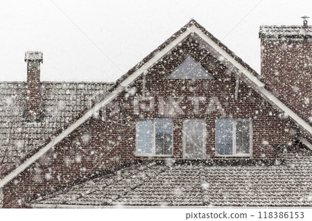 Snowfall outside the window 118386153