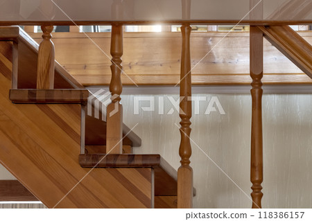 Fragment of a wooden staircase Fragment of a wooden staircase 118386157