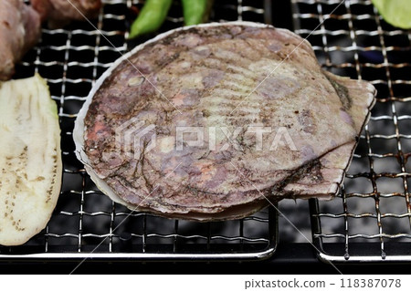 Scallops being grilled on a barbecue Scallops being grilled on a barbecue 118387078