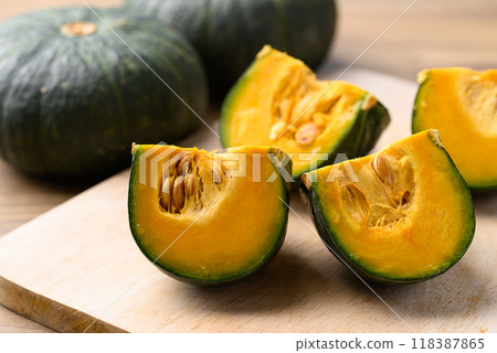Green pumpkin or Japanese pumpkin on cutting wooden board 118387865