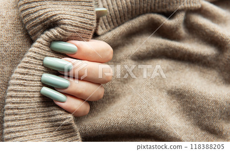 Elegant hand with long green nails  118388205