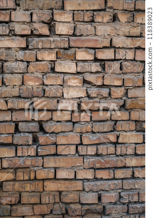 Vertical background of an old brick wall Vertical background of an old brick wall 118389023