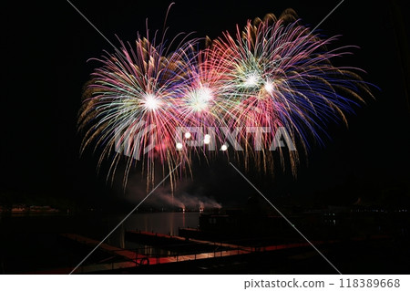 Firework. Beautiful colorful fireworks on the water surface with a clean black background. Fun festival and contest of Firefighters. Brno Dam - Czech Republic. Firework. Beautiful colorful fireworks on the water surface with a clean black background. Fun festival and contest of Firefighters. Brno Dam - Czech Republic. 118389668