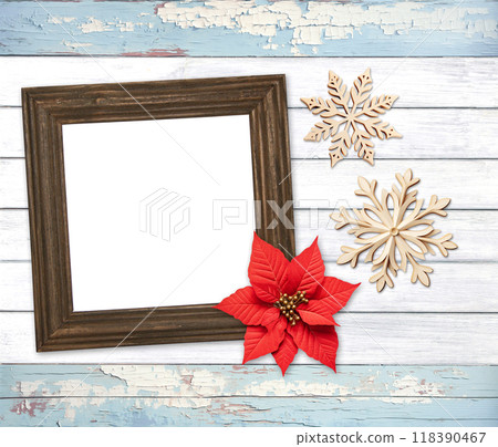 Eco friendly holiday backdrop. Christmas background with retro wooden frame, poinsettia, snowflake on wooden boards. Copy space for text. Ecology, environmental conservation, zero waste concept 118390467
