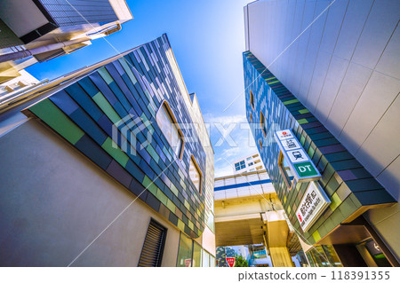 Tokyo cityscape, Japan, September. Tokyu Railway Komazawa Daigaku Station west exit and elevator, with the east exit in the background. 118391355