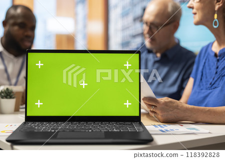 Financial advisor and old clients exploring retirement plans options next to isolated copy space on laptop to ensure stability for retired people. Broker offering his professional advice. Financial advisor and old clients exploring retirement plans options next to isolated copy space on laptop to ensure stability for retired people. Broker offering his professional advice. 118392828