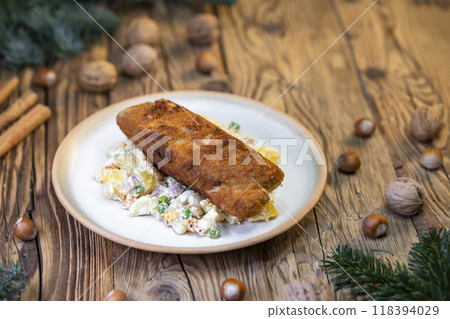 Traditional Christmas dinner in Czech Republic - carp fillet with potato salad Traditional Christmas dinner in Czech Republic - carp fillet with potato salad 118394029