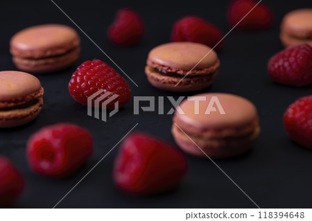 macaroons of different colors on a black background macaroons of different colors on a black background 118394648