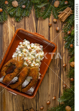 Traditional Christmas dinner in Czech Republic - fried carp with potato salad 118395013