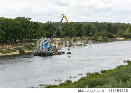 Belarus, Gomel - August 30, 2017: Vessel of the technical fleet clears the river bed of the Sozh River. The ship of the technical fleet cleans the river Sozh 118395216