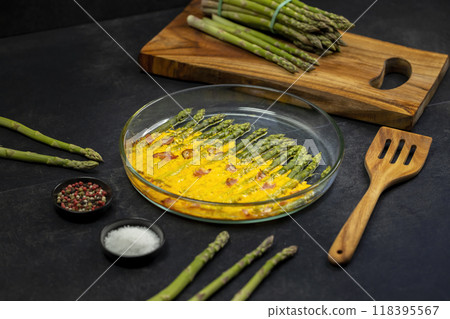 green asparagus baked with chedar cheese and parma ham green asparagus baked with chedar cheese and parma ham 118395567
