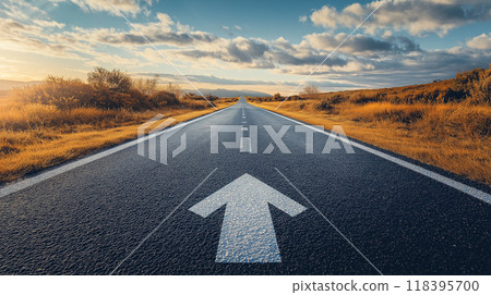 A long, asphalted road with upward arrows symbolizing growth, development, and the journey to success 118395700