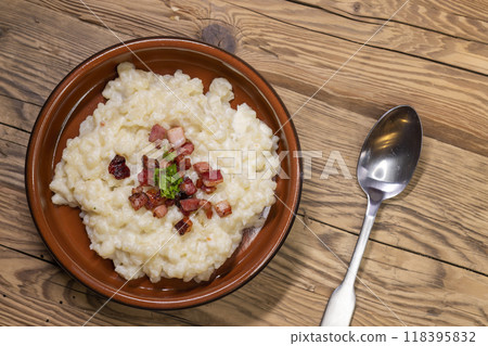 Slovakian halusky served with sheep cheese and roasted bacon 118395832