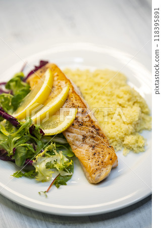 salmon fillet with couscous and vegetables salad 118395891