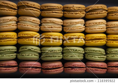 macaroons of different colors on a black background macaroons of different colors on a black background 118395922