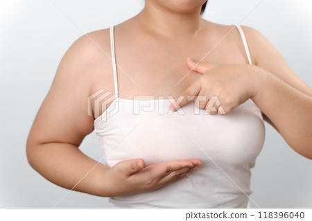 A woman is wiping her hands with a paper towel A woman is wiping her hands with a paper towel 118396040