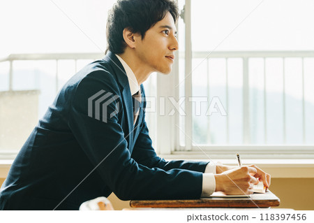 Male high school student taking classes at school Male high school student taking classes at school 118397456