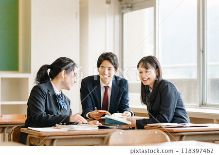 High school students chatting in the classroom High school students chatting in the classroom 118397462