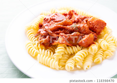 Fusilli, a short pasta dish with delicious tomato sauce Fusilli, a short pasta dish with delicious tomato sauce 118398470