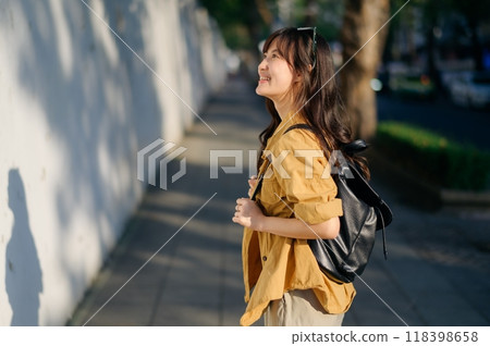 Traveler young asian woman in her 30s explores Bangkok's vibrant evening scene. Unwind, discover, and embrace the excitement of solo travel. Traveler young asian woman in her 30s explores Bangkok's vibrant evening scene. Unwind, discover, and embrace the excitement of solo travel. 118398658