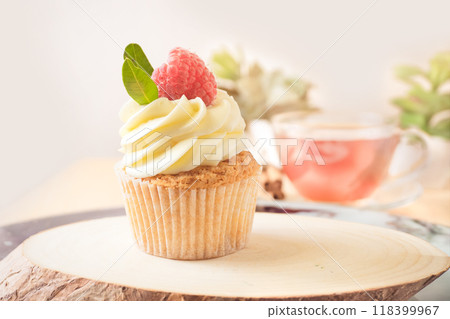 Cupcake with Cream and Raspberry Cupcake with Cream and Raspberry 118399967
