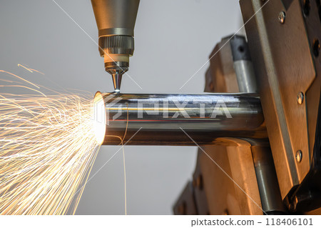 Close up scene the fiber laser cutting machine cut the stainless steel tube and laser beam light. 118406101
