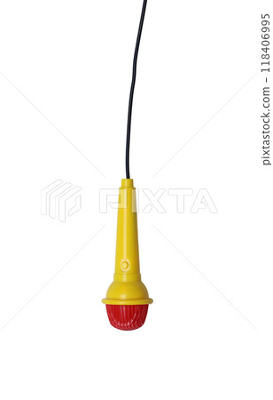 Children's toy microphone is yellow and has a black wire plugged into it with isolated. Children's toy microphone is yellow and has a black wire plugged into it with isolated. 118406995